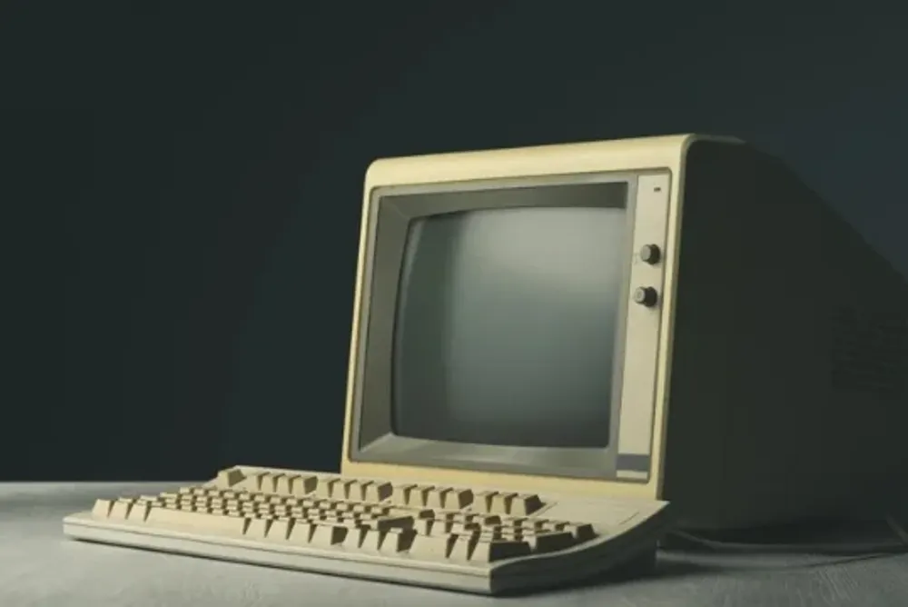 A vintage computer on a desktop.